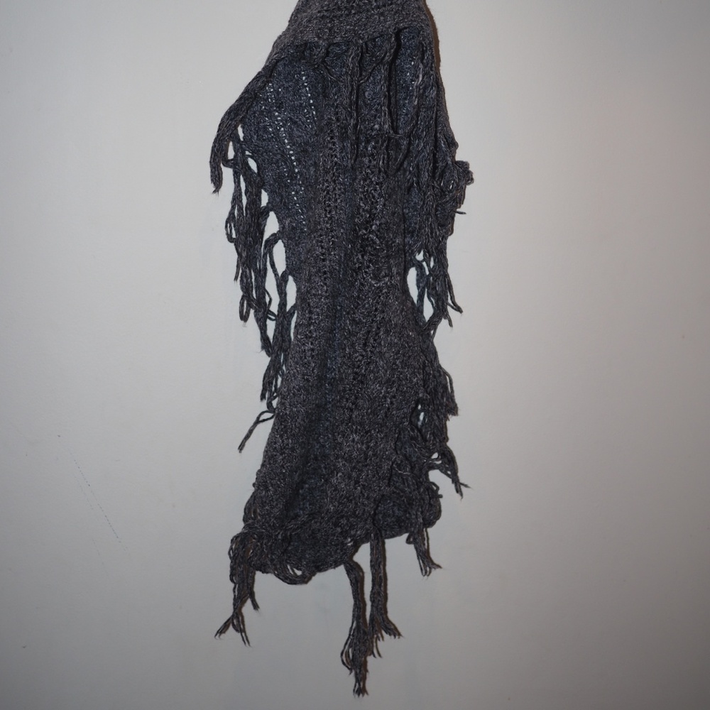 Fringed, knitted infinity scarf.